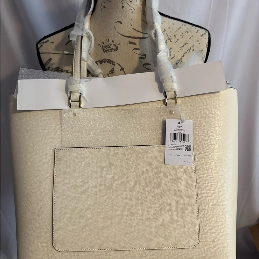 kate spade Cream Tote with Decorative Cutouts and Scarf Accent